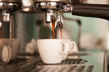 Espresso stream from coffee making machine.