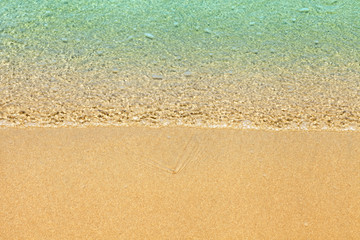 Fototapeta na wymiar Soft wave of blue ocean on sandy beach. Empty blue sea. View of nice tropical beach Horizon with Cream color sand . Holiday and vacation concept.