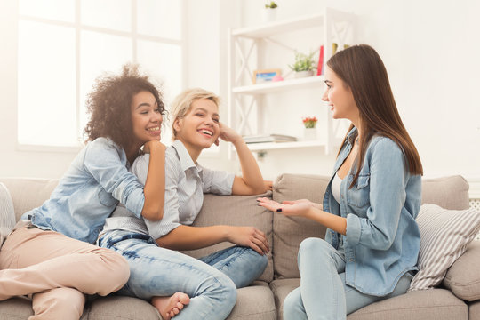 Female friends chatting at home