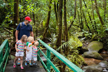Family hiking in jungle.