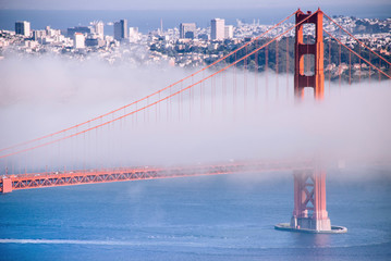 San Francisco Golden Gate bridge on foggy day dramatic evening light view from Marin Headland side