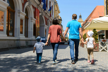 Family Walking in City