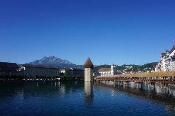 Fototapeta na wymiar Water tower in Switzerland town at a lake