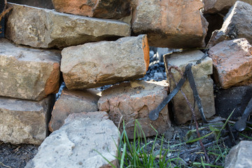 Old bricks lying outdoors. Rustic old background.