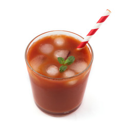 Tomato juice in a glass isolated on a white background