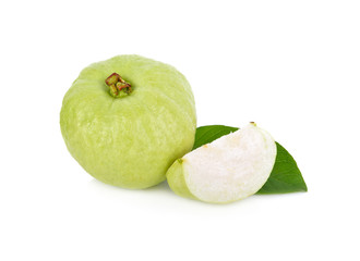 whole and cut fresh guava with leaves on white background