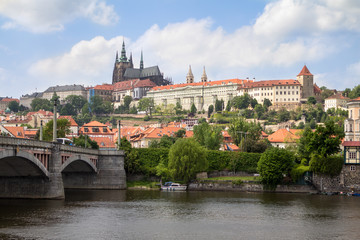 Fototapeta na wymiar Prague Castle and Charles Bridge in Prague across the river Vltava