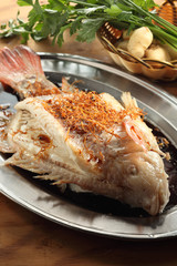 Steamed tilapia fish with soy sauce