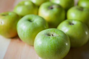 Many green large apples