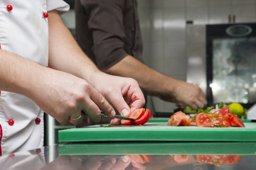 Hands cook cooked vegetables Close-up