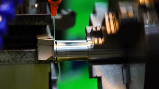 mechanical part grinding by lathe machine in work shop