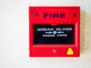 UK Fire Alarm on white wall with tested stickers