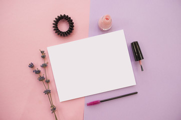 Set of cosmetics on pink and violet background.