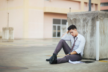 Young businessmen are stressed out of work, Young unemployed businessman