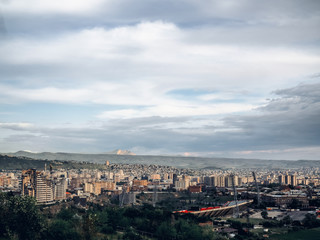Fototapeta na wymiar aerial view of Yerevan city on cloudy day, Armenia