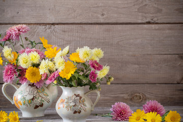 still life with chrysanthemums on old wooden background