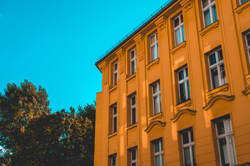 orange apartment house at berlin with copy space in the sky