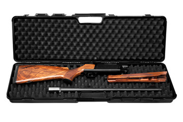 Disassembled hunting rifle in a plastic gun case isolated on white.