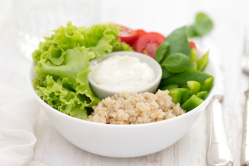 boiled quinoa with lettuce, pepper, tomato and sauce