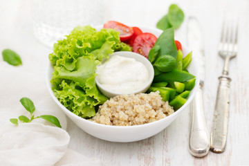 boiled quinoa with lettuce, pepper, tomato and sauce