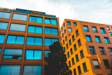 orange apartment complexes at potsdamer platz with blue square windows