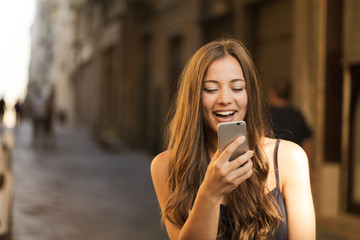 Excited girl talking on the phone