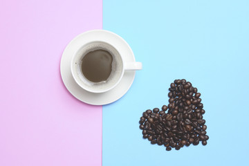 coffee and heart shape coffee bean on pink and blue background