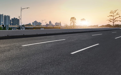 Fototapeta premium Air highway asphalt road and office building of commercial building in modern city