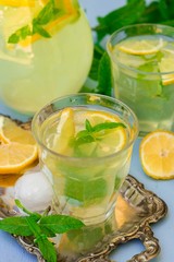 Sweet lemon beverage lemonade with mint and ice cubes