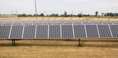 solar panel small field, in-line, yellow grass
