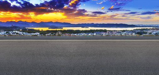 Asphalt road square and river hill under the blue sky