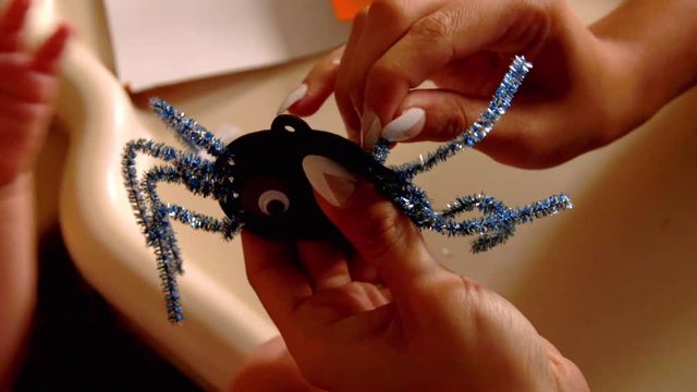 Video Of A Young Toddler Boy Making Spooky Halloween Crafts With His Mom At Their Living Room Table