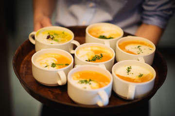delicious soup in terrine with cream and herbs