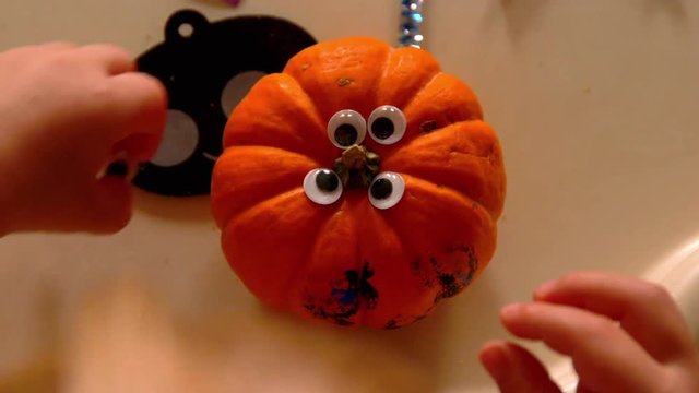 Video Of A Young Toddler Boy Making Spooky Halloween Crafts With His Mom At Their Living Room Table
