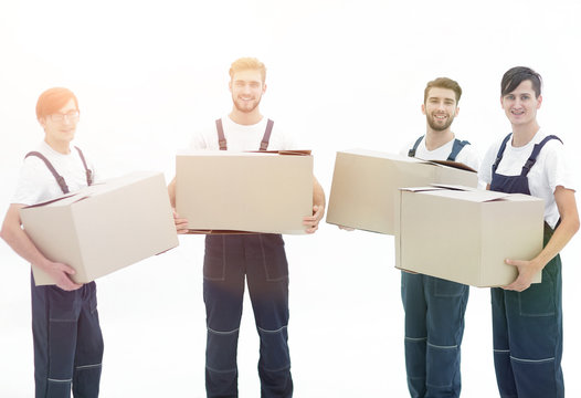 photo workers holding boxes when moving flats,