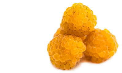 yellow raspberries with leaf isolated on white background macro