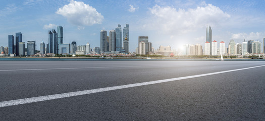 Obraz premium Prospects for expressway, asphalt pavement, city building commercial building, office building