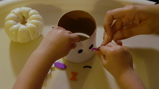 Video Of A Young Toddler Boy Making Spooky Halloween Crafts With His Mom At Their Living Room Table