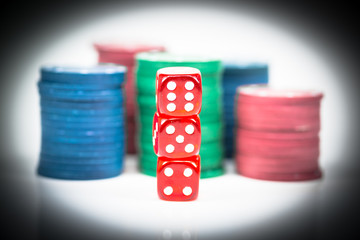 Red dice with banknotes as background.