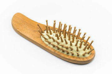 Wooden comb on white floor