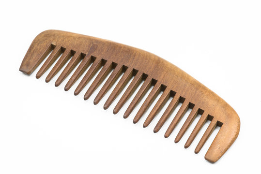 Wooden comb on white floor