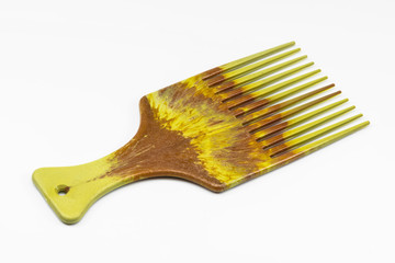 Wooden comb on white floor