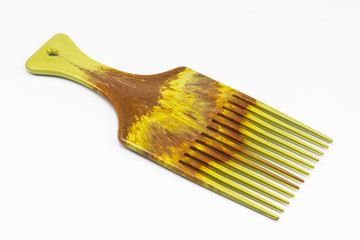 Wooden comb on white floor