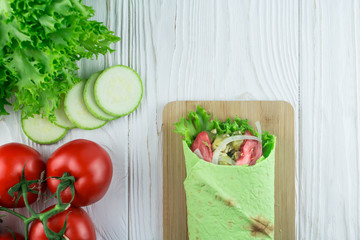 vegetarian shawarma from vegetables, on a wooden background