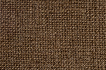 Fototapeta na wymiar The linen cloth in brown color. Canvas for printing. Abstract color background.