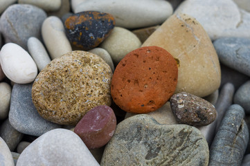 boulders and colorful pebbles on the beach