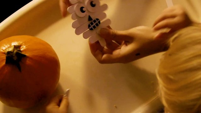 Video Of A Young Toddler Boy Making Spooky Halloween Crafts With His Mom At Their Living Room Table