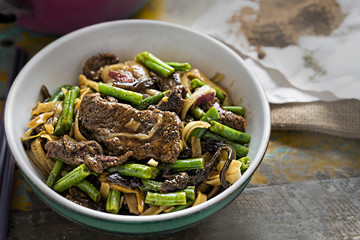 Wok fried beef, green beans, mushroom with rice noodles