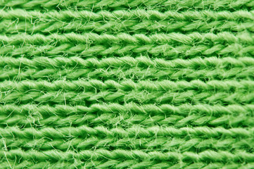 Close-up of texture fabric. Green cloth textile background. Macro