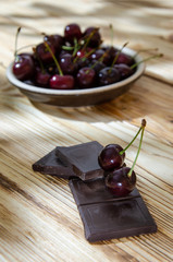 Cherry splice on broken chocolate and a shadow from the leaves.